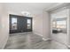 Bright bedroom with stylish gray floors and an adjacent room at 8116 Haywood Estate Ave, Las Vegas, NV 89113