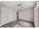 Bedroom features a ceiling fan, double closet and light walls at 8116 Haywood Estate Ave, Las Vegas, NV 89113