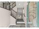 Inviting entryway featuring a wood and steel staircase and stylish gray flooring at 8116 Haywood Estate Ave, Las Vegas, NV 89113