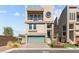 Charming two-story home featuring multi-story architecture, a balcony, and an attached garage at 8116 Haywood Estate Ave, Las Vegas, NV 89113