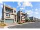 Modern homes featuring multi-story architecture, balconies, attached garages and manicured front yards at 8116 Haywood Estate Ave, Las Vegas, NV 89113