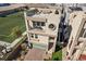 Modern home with a rooftop deck, a balcony, a garage, and lush landscaping at 8116 Haywood Estate Ave, Las Vegas, NV 89113