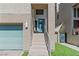 Modern home featuring a stairway leading to the front door and an attached garage at 8116 Haywood Estate Ave, Las Vegas, NV 89113