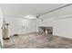 Spacious two-car garage featuring epoxy floors and ample space for storage at 8116 Haywood Estate Ave, Las Vegas, NV 89113
