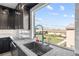 Kitchen sink featuring mountain views, with modern faucet and granite countertops at 8116 Haywood Estate Ave, Las Vegas, NV 89113