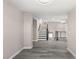 Open living area features a staircase and access to additional rooms at 8116 Haywood Estate Ave, Las Vegas, NV 89113