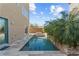 Refreshing pool surrounded by lush tropical greenery and stone pavers for outdoor enjoyment at 8116 Haywood Estate Ave, Las Vegas, NV 89113