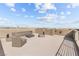 Relax on this spacious rooftop deck complete with stylish seating, a fire pit, and panoramic views of the surrounding area at 8116 Haywood Estate Ave, Las Vegas, NV 89113