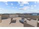 This rooftop patio offers ample seating and a cozy fire pit ideal for gatherings or simply enjoying the views at 8116 Haywood Estate Ave, Las Vegas, NV 89113