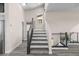 Staircase featuring gray wood-look tile and metal railings at 8116 Haywood Estate Ave, Las Vegas, NV 89113