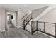 Modern staircase with rod iron railing at 8116 Haywood Estate Ave, Las Vegas, NV 89113