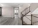 Modern staircase with rod iron railing and open floor plan at 8116 Haywood Estate Ave, Las Vegas, NV 89113