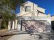 Inviting two-story home with a neutral color palette and a well-maintained two car garage at 8244 Sickle Ln, Las Vegas, NV 89128