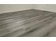 Close-up showcasing the gray wood-style laminate flooring, adding a modern touch to the home's interior at 8244 Sickle Ln, Las Vegas, NV 89128