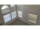 Bright living space with tall windows and neutral walls, creating a welcoming ambiance at 8244 Sickle Ln, Las Vegas, NV 89128