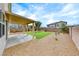 Backyard with stone landscaping, small patio, and overhead awning at 9629 Grouse Grove Ave, Las Vegas, NV 89148