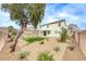 Backyard with lawn, rock landscaping, and perimeter block wall at 9629 Grouse Grove Ave, Las Vegas, NV 89148