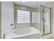Modern bathroom featuring soaking tub and glass shower at 9629 Grouse Grove Ave, Las Vegas, NV 89148