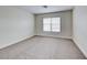 Bedroom with neutral carpet, base trim and window providing natural light at 9629 Grouse Grove Ave, Las Vegas, NV 89148