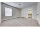 Bedroom featuring a walk-in closet, neutral carpet, and a window at 9629 Grouse Grove Ave, Las Vegas, NV 89148