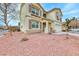 Close-up of home's exterior shows stucco, double-hung windows and xeriscaping at 9629 Grouse Grove Ave, Las Vegas, NV 89148