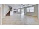 Large living room boasts tile floors, access to the backyard, and an open floor plan at 9629 Grouse Grove Ave, Las Vegas, NV 89148