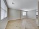 Bright and airy living room featuring stylish tile flooring and large windows at 9629 Grouse Grove Ave, Las Vegas, NV 89148