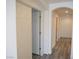 Neutral hallway features modern gray flooring, white trim and archway at 9739 Fox Estate St, Las Vegas, NV 89141