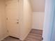 Hallway features wood-look flooring and a door leading to additional space at 9739 Fox Estate St, Las Vegas, NV 89141