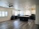 A spacious kitchen featuring a central island and stainless steel appliances at 9739 Fox Estate St, Las Vegas, NV 89141