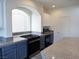 Close-up of the kitchen, showcasing granite countertops and stainless steel appliances at 9739 Fox Estate St, Las Vegas, NV 89141