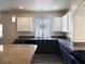Spacious kitchen with granite countertops, an island, and stainless steel appliances at 9739 Fox Estate St, Las Vegas, NV 89141