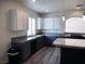 Spacious kitchen featuring an island with barstool seating and stainless steel appliances at 9739 Fox Estate St, Las Vegas, NV 89141