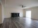Spacious living room features vinyl flooring, a fireplace and plenty of natural light at 9739 Fox Estate St, Las Vegas, NV 89141