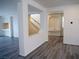 Open-concept living area with staircase, built-in shelving, and modern flooring at 9739 Fox Estate St, Las Vegas, NV 89141