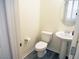 Bright powder room with pedestal sink and modern fixtures at 9739 Fox Estate St, Las Vegas, NV 89141