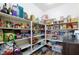 Walk-in pantry featuring ample shelving, offering plentiful storage for food and kitchen essentials at 10095 Ferton Lake Ave, Las Vegas, NV 89178