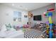 Spacious playroom with toys, games, and comfortable seating area at 10095 Ferton Lake Ave, Las Vegas, NV 89178