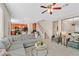 Spacious living room showcases an open floor plan, connecting to the kitchen and staircase at 10449 Yew Blossom Ave, Las Vegas, NV 89166