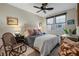 Comfortable bedroom with neutral decor, ceiling fan, and lots of natural light at 11283 Gravitation Dr, Las Vegas, NV 89135