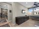 Bedroom featuring wood floors, a workstation and attached bathroom at 11283 Gravitation Dr, Las Vegas, NV 89135