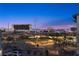 Striking twilight view of the city skyline from a balcony at 11283 Gravitation Dr, Las Vegas, NV 89135