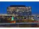 Distant cityscape at dusk with a large office building in the foreground at 11283 Gravitation Dr, Las Vegas, NV 89135