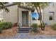 Charming home entrance with landscaping and a welcoming front door at 11283 Gravitation Dr, Las Vegas, NV 89135