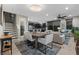 Open-concept living and dining area with hardwood floors and stylish furnishings at 11283 Gravitation Dr, Las Vegas, NV 89135