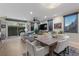 Open living area with hardwood floors, comfortable seating, and access to an outdoor patio at 11283 Gravitation Dr, Las Vegas, NV 89135