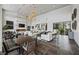 A chic lounge featuring stylish seating, a fireplace, statement lighting, and tasteful decor perfect for relaxing at 11283 Gravitation Dr, Las Vegas, NV 89135