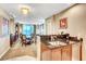 Open concept kitchen with sleek countertops, stainless steel sink, and seamless flow to the adjacent dining area at 125 E Harmon Ave # 1620, Las Vegas, NV 89109