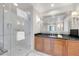 Contemporary bathroom featuring walk-in glass shower and dark wood vanity at 135 E Harmon Ave # 221, Las Vegas, NV 89109