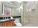 Stylish bathroom with glass-enclosed shower, sleek vanity, and modern fixtures at 135 E Harmon Ave # 221, Las Vegas, NV 89109